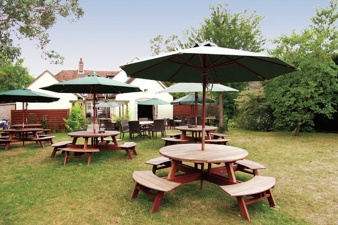 Picnic tables and parasols in the beer garden