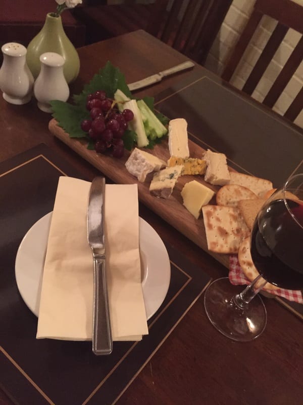A cheeseboard with grapes and crackers