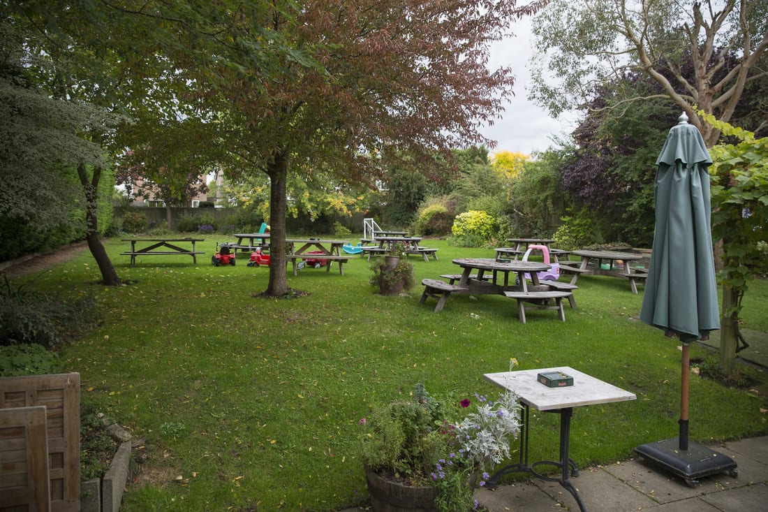 The lawn and garden tables under the trees