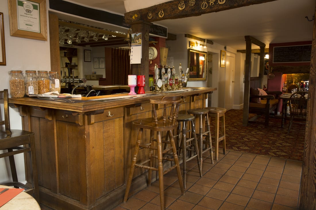 The bar, with stools and a row of optics